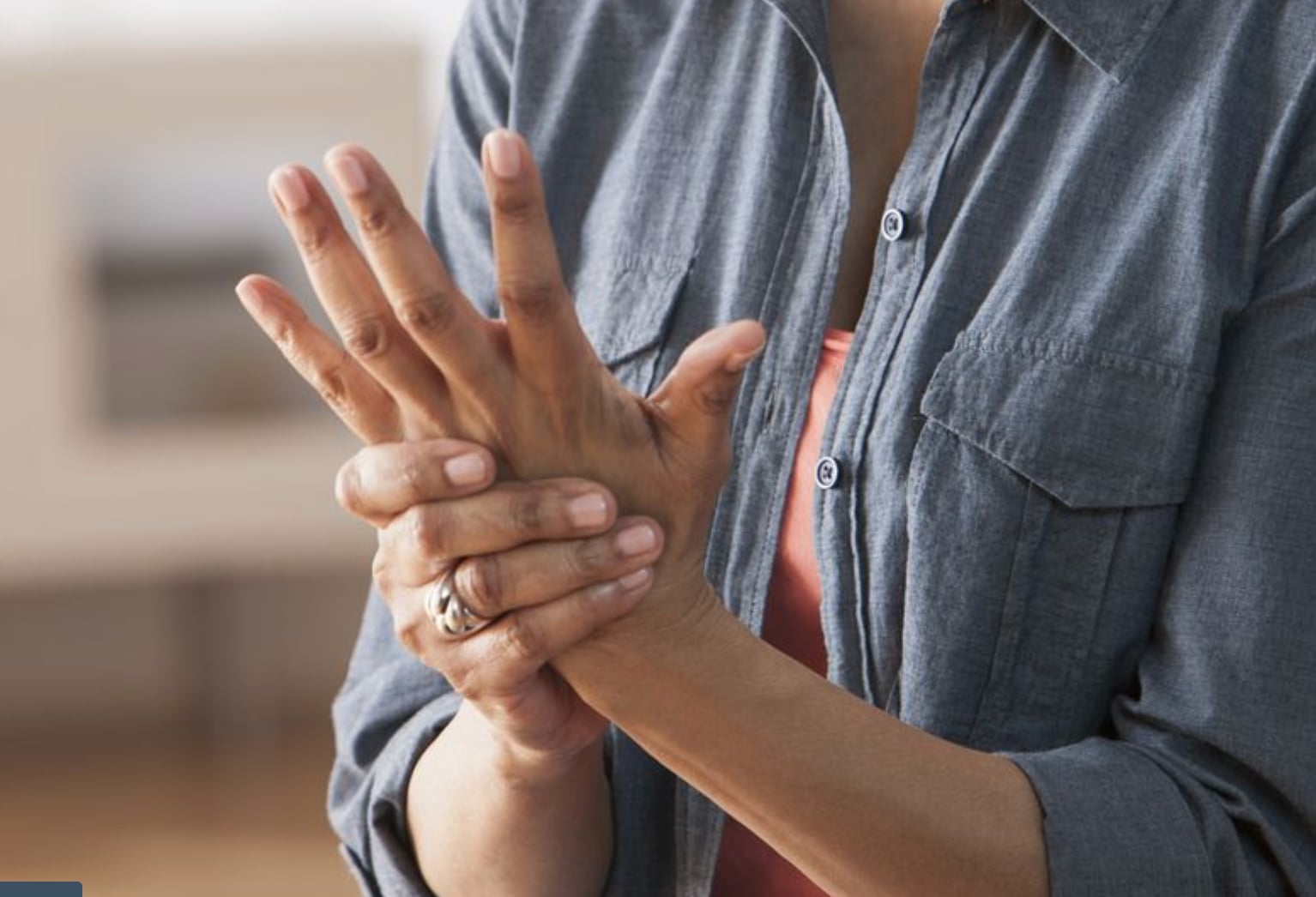 A person holding their wrist