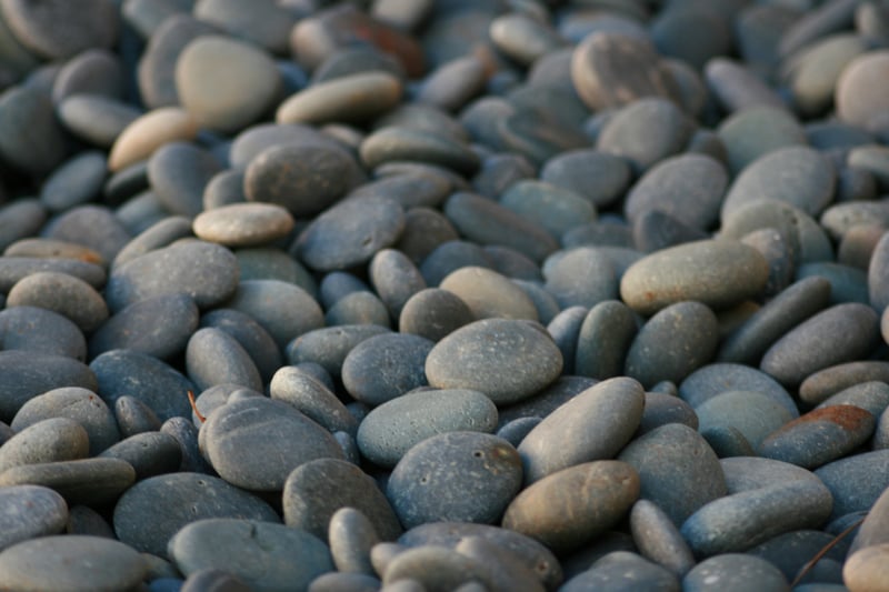 Smooth grey pebbles covering the ground