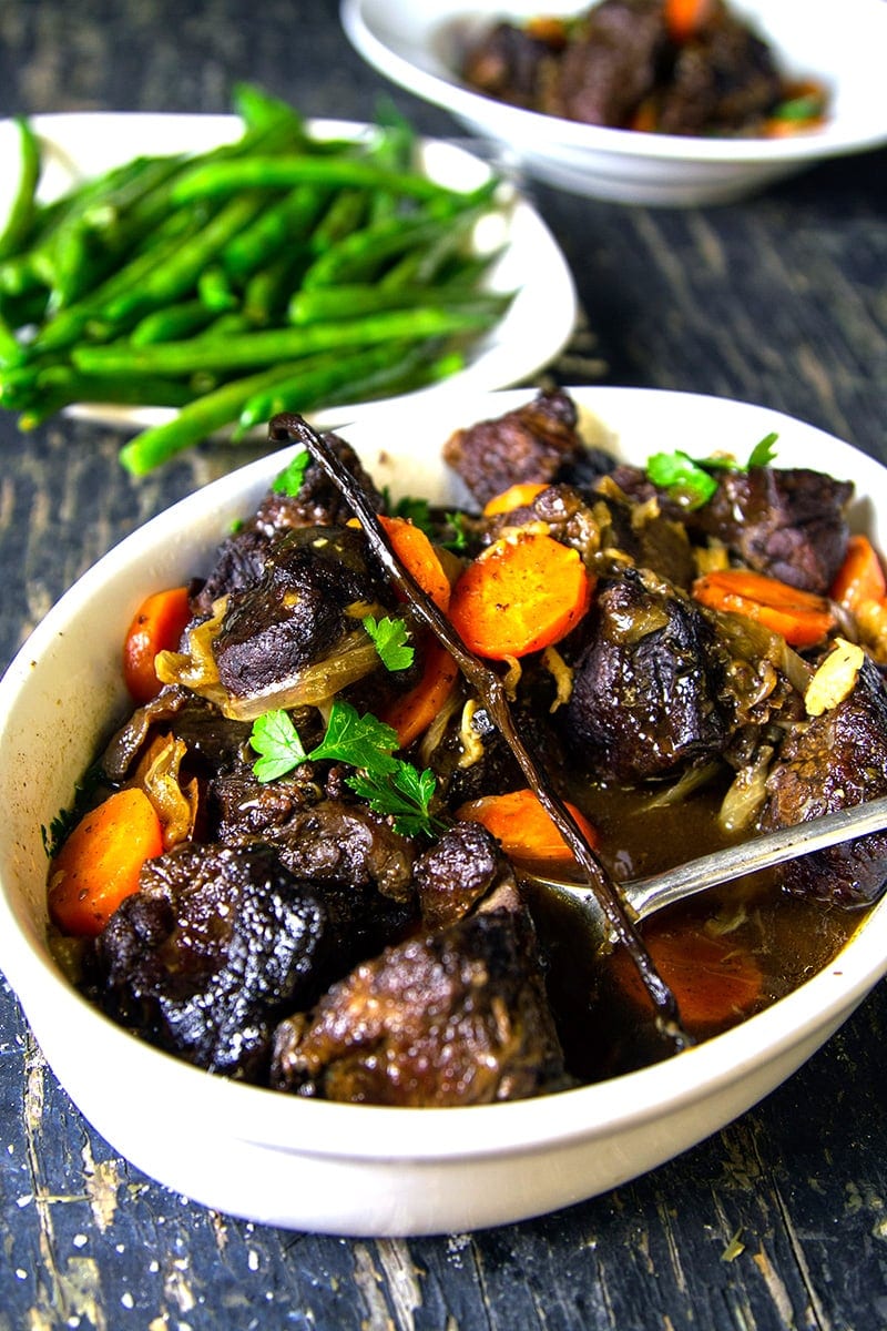 A bowl of slow-cooked beef with vegetables